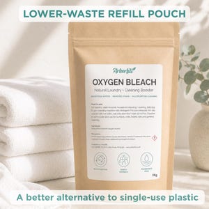 May include: A brown paper refill pouch labeled Arborfill Oxygen Bleach, a natural laundry and cleaning booster. The label includes instructions, ingredients, and icons for multipurpose, family friendly, and fragrance free use, marked as 1kg.