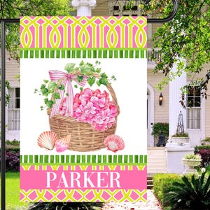 May include: A handmade wooden sign with the text "Welcome to our home" in a handwritten style. The sign is painted white with a distressed finish and features a black border. A small, decorative heart is attached to the bottom.