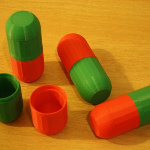 Opened Christmas-Themed Small Storage Capsules - Red and Green Organization and Cosplay Accessories A lifestyle shot showing one of the small storage capsules with its lid screwed open, revealing its interior.