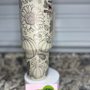 Sunflower Stanley. Custom laser etched Stanley with sunflowers, pumpkins, and acorns. Stanley laser etched custom tumbler. Custom Stanley. Sunflower Stanley. Fall vibe custom sunflower cup. Sunflower mug. floral tumbler cup.