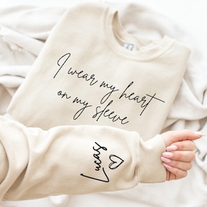 I Wear My Heart On My Sleeve Sweatshirt for Mothers Day, Custom Mama Sweatshirt with Kids Name on Sleeve, Mother Day Gift for Mom, Mom Gift image 1
