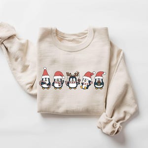 Penguin Merry Christmas Sweatshirt, North Pole Christmas Sweatshirt, Cute Penguin Xmas Light Sweater, Christmas Penguin Lover Shirt