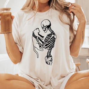 Skeleton And Cat Sweatshirt, Cat Halloween Shirt, Womens Skeleton Halloween Shirt, Cat Lover Halloween Gift, Skull Shirt, Fall Graphic Tee