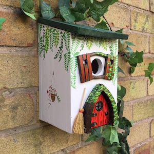Bird house, bird box, hand painted in a cottage style with fairy door and shutters.  Mother’s Day, birthday gift.  Yard art decoration.