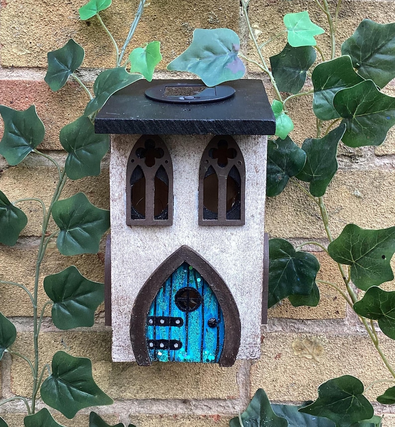 Solar Fairy House, Solar Powered Wooden Garden Cottage, Light Up Whimsical Decor, Illuminated Fairy Garden House with Sparkly Door & Lantern Glittering blue