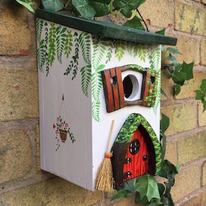 Birthday gift. Bird house, hand painted in a cottage style with a red fairy door, shutters, fairy broom,  Gift for gardeners, nesting box