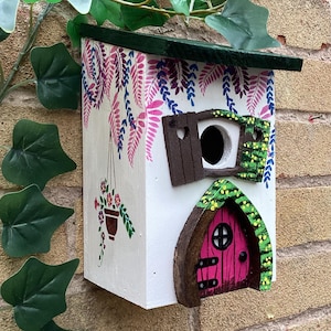 Whimsical Fairy Cottage Birdhouse – hand painted wooden bird box with cascading leaves, hanging basket & fairy door, yard art, housewarming.