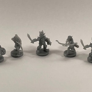 May include: A set of eight grey plastic miniature figurines of goblins, each with a different weapon or accessory. The goblins are posed in various fighting stances.