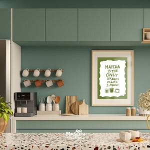 May include: A green and white kitchen print with the text "Matcha is the only green flag I need". The print is framed and hanging on a green wall.
