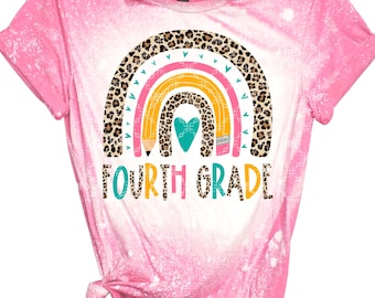 May include: A pink bleached t-shirt with a rainbow design featuring a leopard print, pencils, and a heart. The text "FOURTH GRADE" is written below the rainbow.