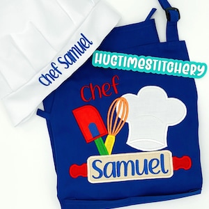 May include: A white chef hat embroidered with the blue text Chef Samuel, paired with a royal blue apron featuring an embroidered red spatula, orange whisk, white chef hat, and a rolling pin with the blue name Samuel and red text Chef.