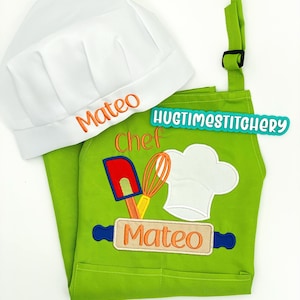 May include: A bright lime green apron and a white chef hat. The hat features the name Mateo embroidered in orange. The apron displays an embroidered design of a red spatula, orange whisk, white chef hat, and a blue rolling pin with Mateo in orange.