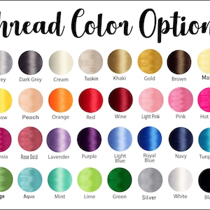 May include: A color chart titled Thread Color Options displaying thirty-two circular swatches of embroidery thread in various shades including grey, cream, gold, brown, maize, peach, orange, red, wine, pink, fuchsia, purple, blue, green, and black.