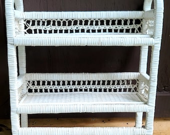White wicker or rattan wall shelf