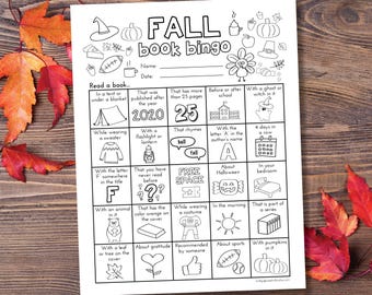 May include: A black and white printable bingo card with the word "FALL" in large letters at the top. The card has a grid of 9 squares with various prompts for reading books, such as "That was published after the year 2020", "With a ghost or witch in it", and "That has the color orange on the cover".