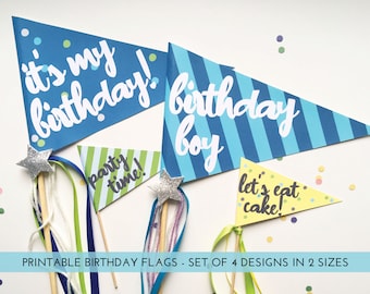 May include: Printable birthday flags in blue, green, yellow, and white with the text "it's my birthday!", "party time!", "birthday boy", and "let's eat cake!"