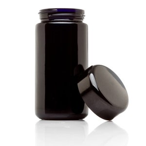 May include: A black glass bottle with a blue lid. The bottle is empty and the lid is off.