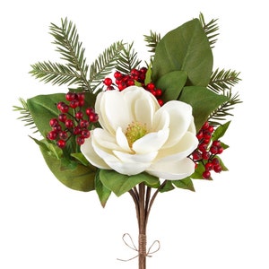 May include: A white magnolia flower bouquet with red berries and green leaves. The stems are tied together with twine.