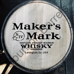 May include: A wooden barrel with a black Maker's Mark logo and text that reads "Kentucky Straight Bourbon Whisky Handmade Lexington, Ky. USA".