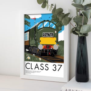 May include: A framed print featuring a green and yellow Class 37 diesel locomotive on a railway track, set against a blue sky with clouds and birds. The print includes the text "CLASS 37" at the bottom.