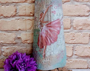 Decoupage on clay tiles. Old decorated brick with ballerina. Painted Turkish tile.