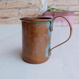 Vintage copper measuring jug, old small measuring cup with handle, bar decor, vintage kitchen utensils.
