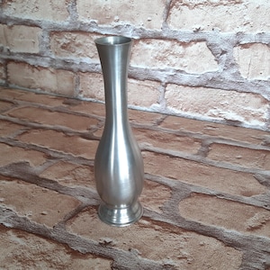 Stainless steel vase. Vintage vase. Silver colored vase. Home decoration. Flower stand.
