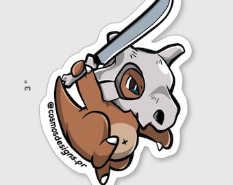 May include: A sticker featuring a cartoon Cubone character holding a silver knife. The Cubone is brown with a skull mask. The sticker is approximately 3 inches in height, with the text "@cosmosdesigns.pr".