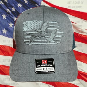 American flag hat with flag and ducks