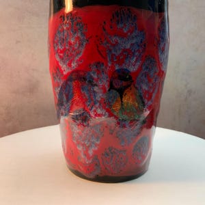 Mug. Two little Chickadees hiding in the brambles away from that old cats sight.