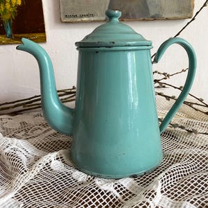Antique coffee pot in enamelled sheet metal,