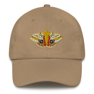 May include: A tan baseball cap with an embroidered yellow, red, and purple moth design.