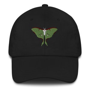 May include: A black baseball cap with an embroidered green luna moth design.