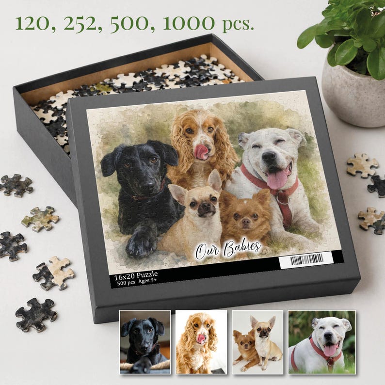 Op de afbeelding: Een puzzeldoos met een aquarel afbeelding van zes honden, met de tekst "Our Babies". De doos is open en onthult puzzelstukjes. De doos heeft ook de tekst "16x20 Puzzle 500 pcs Ages 9+" en de nummers "120, 252, 500, 1000 pcs."