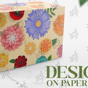 May include: A cardboard box featuring a floral design. The box is decorated with paper flowers in a variety of colours, including red, pink, yellow, blue, and orange. The flowers are arranged in a random pattern on the box.