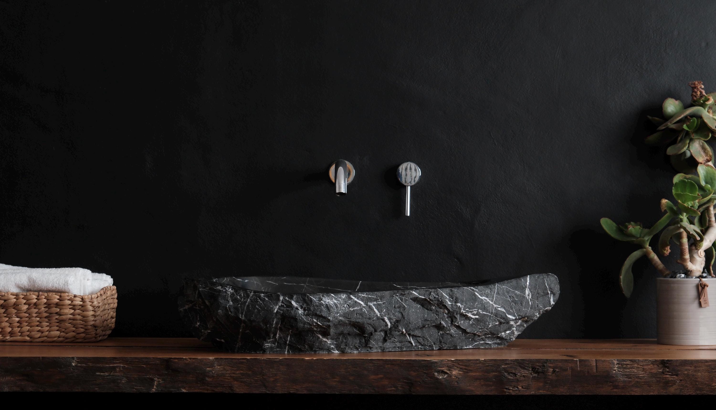 Handcrafted Negro Marquina marble sink: elegant drop-shape basin for modern bathroom vanity.