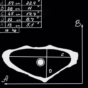 Technical sketch with precise measurements of handmade marble sink in asymmetrical oval form.