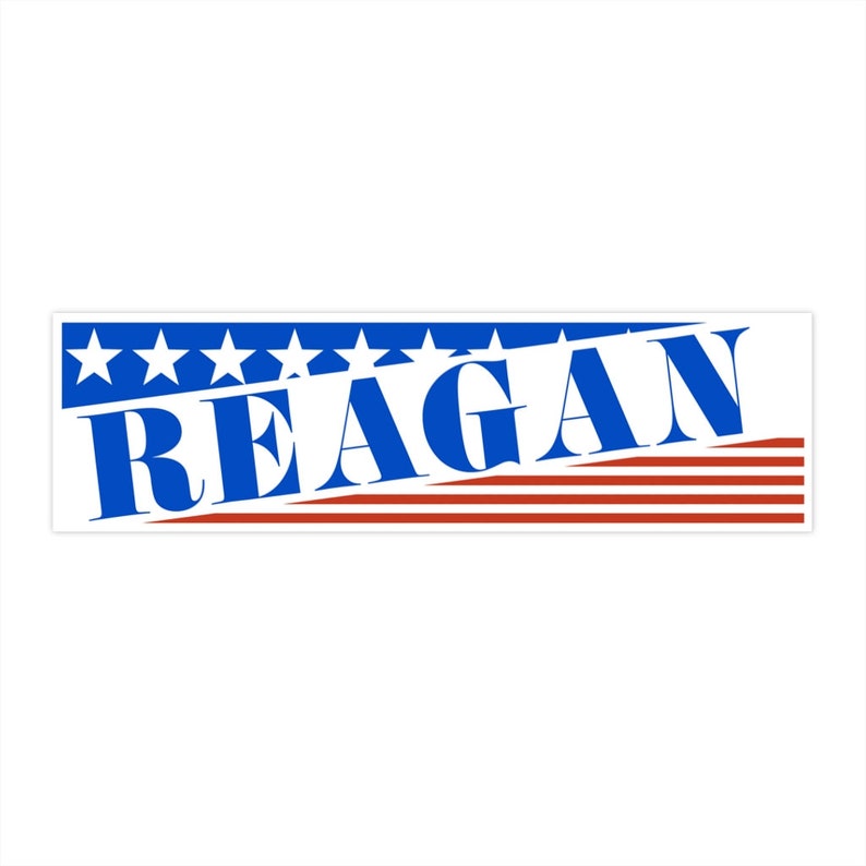 May include: A blue and red American flag design with the word "REAGAN" in bold blue letters.