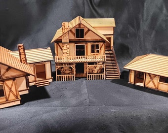 May include: Three wooden model houses with brown roofs and white trim. The houses have windows and doors. The largest house has a second story and a porch.