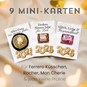 Pode incluir: Três cartões de felicitações com texto dourado e chocolates. Os cartões dizem "Alles Gute im neuen Jahr", "Frohes Neues Jahr für Dich" e "Glück, Liebe & Gesundheit". O ano "2026" é exibido em folha de ouro. O texto "9 MINI-KARTEN" está no topo.