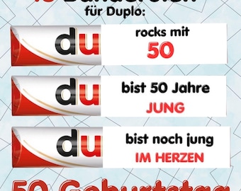 May include: Image features a Duplo candy bar with text in German. The text includes "45 Banderolen", "rocks mit 50", "bist 50 Jahre JUNG", "bist noch jung IM HERZEN", and "50 Geburtstag". The background has a geometric pattern.