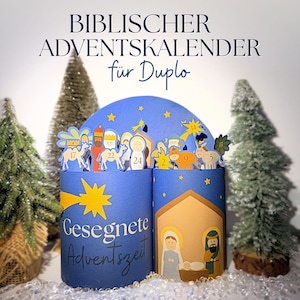 May include: A blue Advent calendar with the text "BIBLISCHER ADVENTSKALENDER" and "Gesegnete Adventszeit". The calendar features illustrations of the nativity scene and the three wise men. The calendar is decorated with gold stars and small Christmas trees.