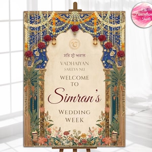 May include: A decorative wedding sign on an easel. The sign features ornate floral and peacock designs, with text in multiple languages, including "Welcome to Simran's Wedding Week."