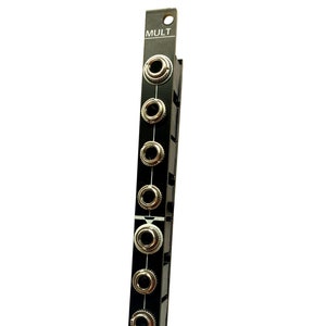 May include: A black Eurorack module with the word "MULT" printed on it. The module has eight 1/4 inch jacks for audio signals.