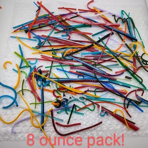 May include: An 8 ounce pack of colorful glass rods, perfect for fusing or lampworking. The rods are in a variety of colors, including blue, green, red, yellow, and orange.