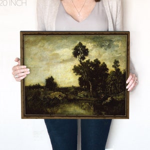 May include: A framed landscape painting depicting a river scene with trees and a cloudy sky. The painting is in a dark brown frame and is 16x20 inches.