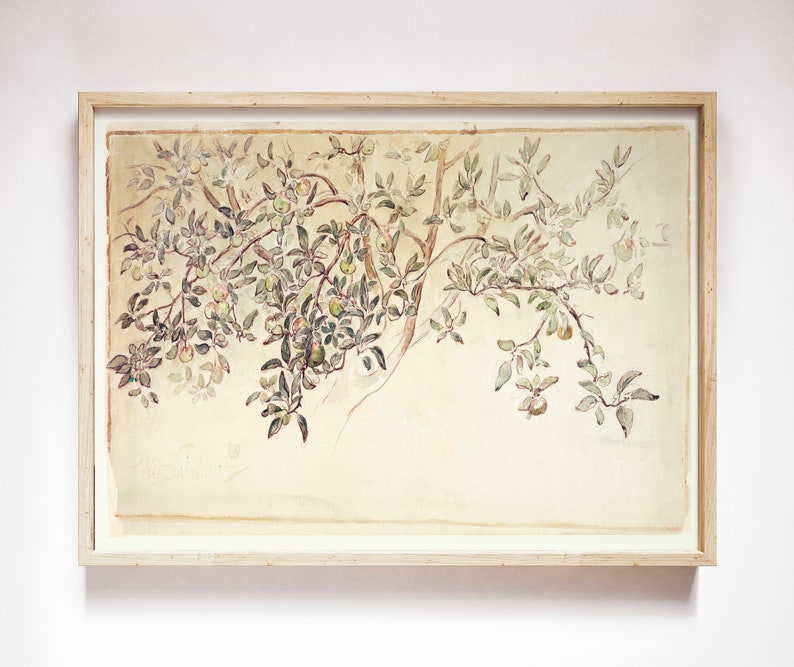 May include: A framed watercolor painting of a tree branch with green leaves and small, light green fruit. The painting is on a light beige background and is framed in a light wood frame.