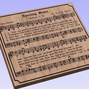 May include: A wood-grain background with a black frame and black text. The text reads "Amazing Grace" with the lyrics and sheet music for the hymn. The text also includes the composer's name, John Newton, and the arranger's name, E. O. Excell.