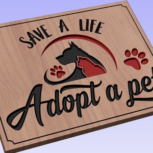 May include: Wooden sign with the text "Save a life Adopt a pet" in black lettering. The sign features a silhouette of a dog and cat in an embrace, with a red paw print.