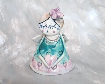 sweet angel with a ceramic heart. 6 cm high